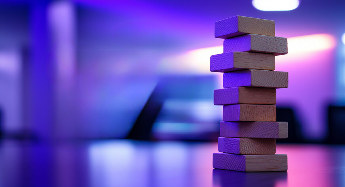 A stack of Jenga blocks signifying the growth and innovation available through a career at Risk Llama