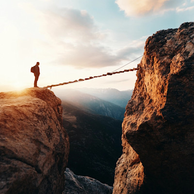 Image of a hiker crossing a valley symbolising Risk Management